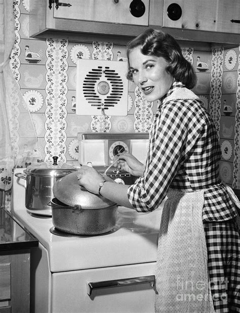 Woman Cooking On Stove C1950s Photograph By Debrockeclassicstock