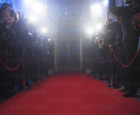 Paparazzi Using Flash Photography Along Red Carpet Stock Photo