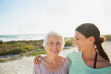 Mother And Daughter On Sunny Beach Stock Photo Dissolve