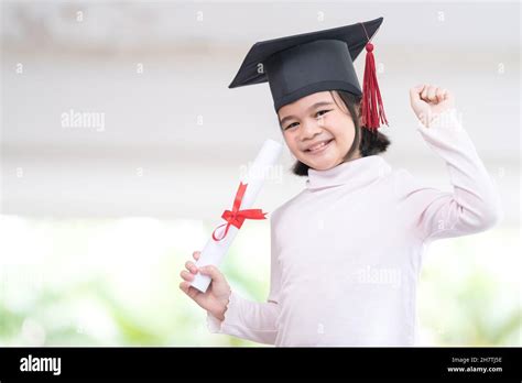 Happy Southeast Asian Schoolgirl With A Certificate Celebrating