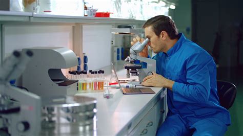 lab doctor looking microscope laboratory doctor using laptop in medical lab medical researcher