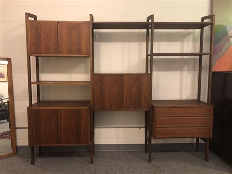 The finish is a walnut veneer. SOLD - Free Standing Mid Century Walnut Wall Unit - Modern ...
