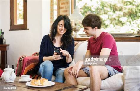 Son Showing Mom Phone Photos And Premium High Res Pictures Getty Images