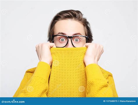 Attractive Man Wearing Yellow Sweater Astonished And Amazed In Shock And Surprise Face