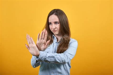 Disappointed Attractive Lady Doing Stop Gesture Showing Palms At