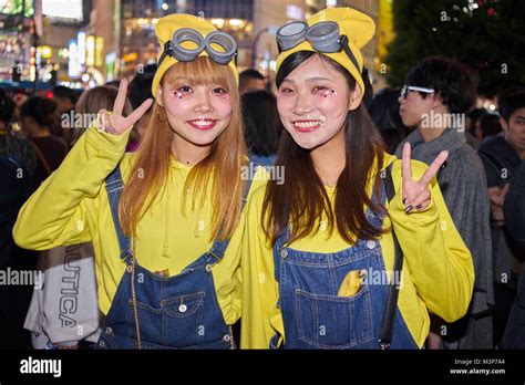 Young Japanese Girls Dressed As Mimions At The Halloween Celebrations In Shibuya Tokyo Stock