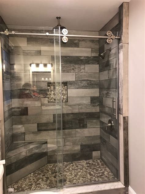 Extra large marble tile surround this primary bath on the floor and all four walls to make it feel like a luxury spa. Master Shower idea | Unique bathroom decor, Bathroom ...