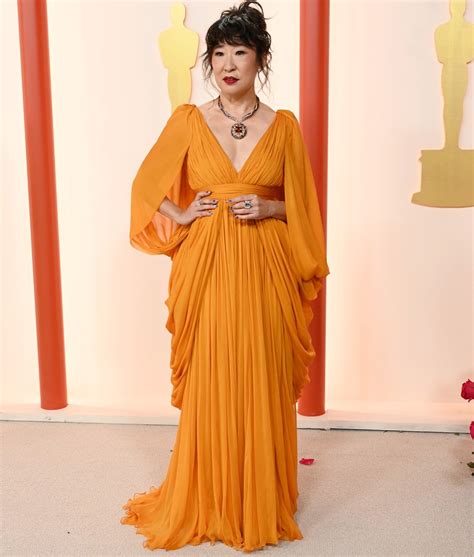 Sandra Oh Makes Statement In Orange At The 2023 Oscars Purewow