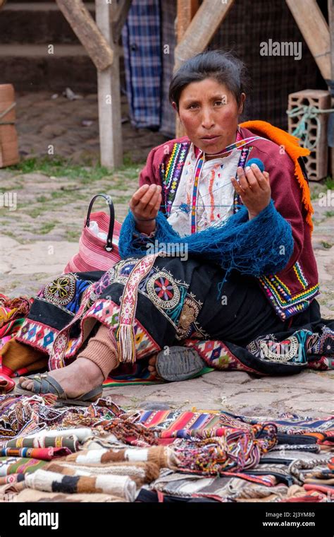 Quechua Woman Wearing Traditional Andes Clothing Weaving At Pisac Town