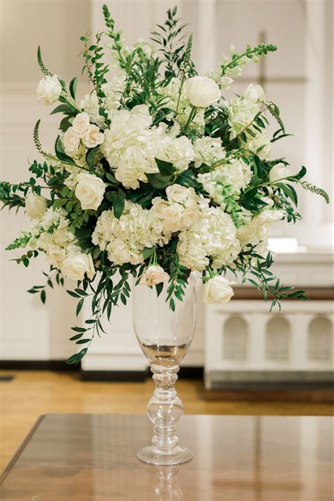 White And Green Altar Centerpieces Set On Our Tall Glass Vases Roses