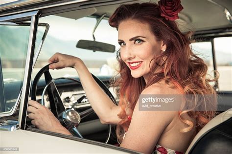 Redhead 50s Pinup Girl Driving Classic Car High Res Stock Photo Getty