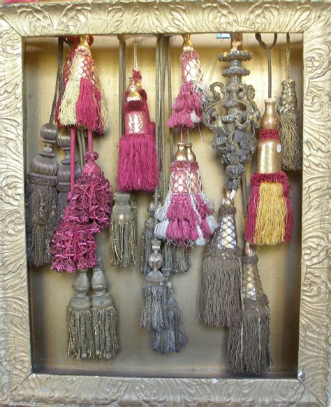 Collection Of Tassels In Shadow Box Ranging In Age From 17th Century To 19th Century Examples