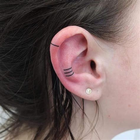 Minimalist Ear Tattoos Are Fast Becoming A Trend