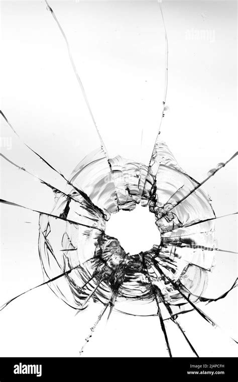 Cracks From Bullets In The Glass Isolated On A White Background Stock