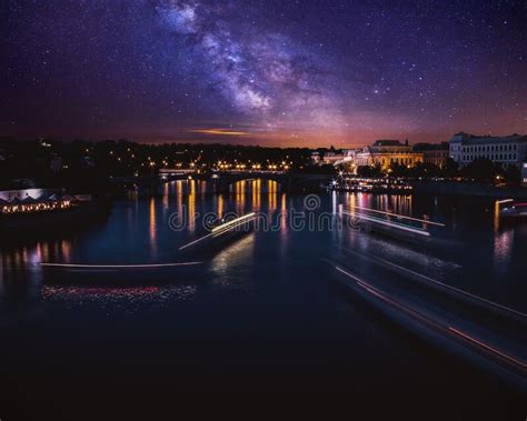 Long Exposure Photo Of Boats On The Vltava River In Prague At Night
