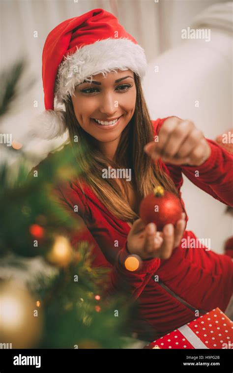 Girl Decorating Christmas Tree Stock Photo Alamy