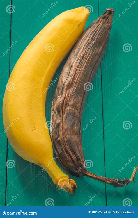 Fresh And Rotten Banana On Wooden Background Stock Photo Image Of