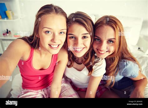 Happy Friends Or Teen Girls Taking Selfie At Home Stock Photo Alamy