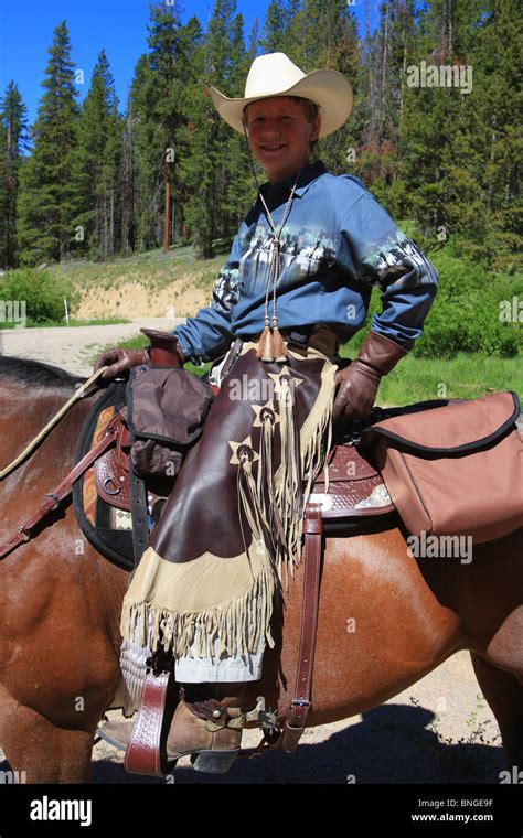 Cowboy Riding A Horse Stock Photo Alamy