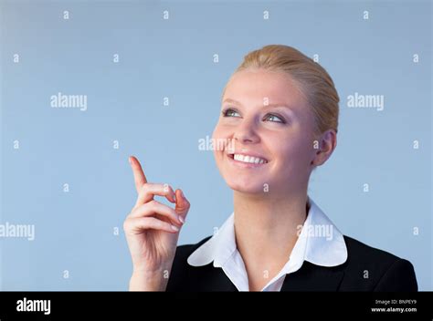 Happy Businesswoman Pointing Upwards Stock Photo Alamy