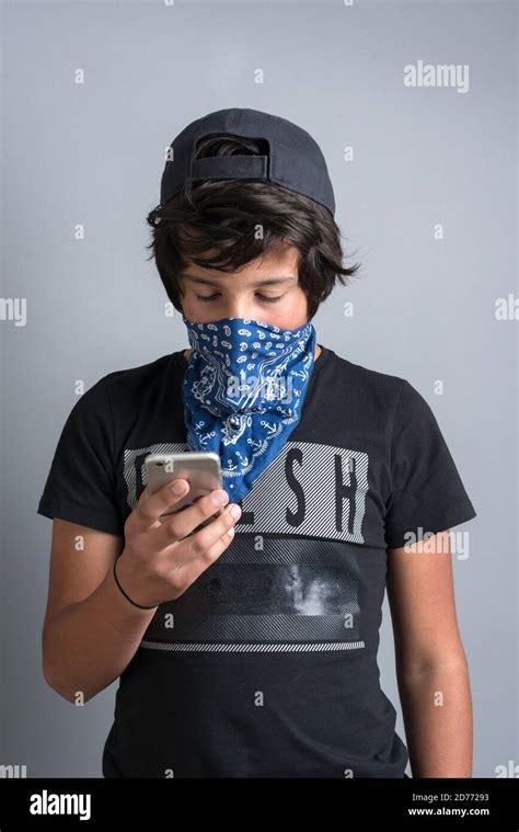 Teenage Boy Wear Bandana As Face Mask On His Phone Stock Photo Alamy