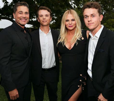 rob lowe and sons pose together in shirtless boat photo