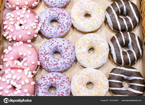 Assorted Donuts With Chocolate Frosted Pink Glazed And Sprinkles