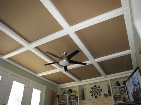 How to cover popcorn ceiling with decorative ceiling tiles. Hubby got this idea from a magazine, panels and beams of ...