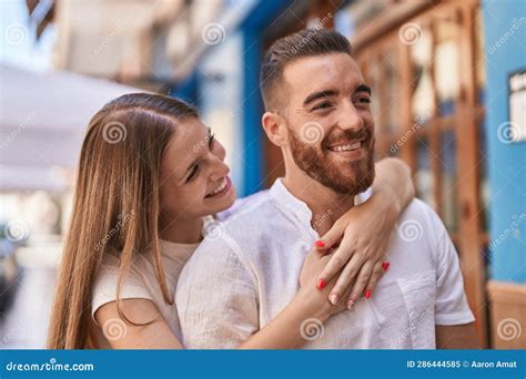 man and woman couple smiling confident hugging each other at street stock image image of