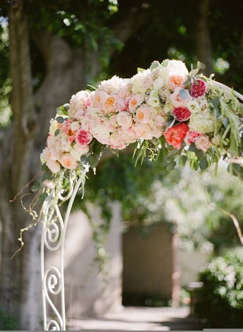 White Arch Of Pastel Flowers Wedding Ceremony Flowers