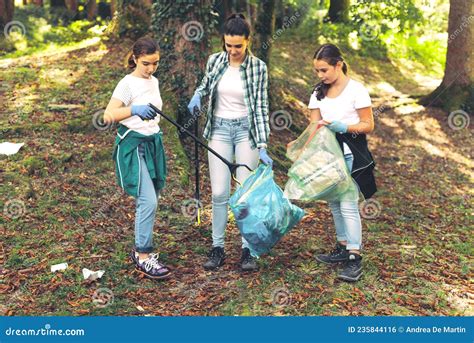 Cleanup Volunteers Collecting Trash In The Forest Stock Photo Image