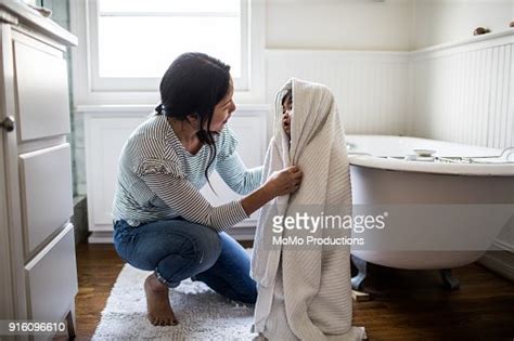 Mother Drying Daughter Off After Bath Photo Getty Images