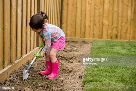 Kids Digging In Garden Photos And Premium High Res Pictures Getty Images