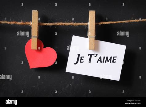Heart With Je Taime Poster Hanging With Blackboard Background Stock
