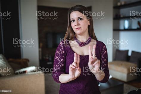Beautiful Deaf Woman Communicating In Sign Language Stock Photo