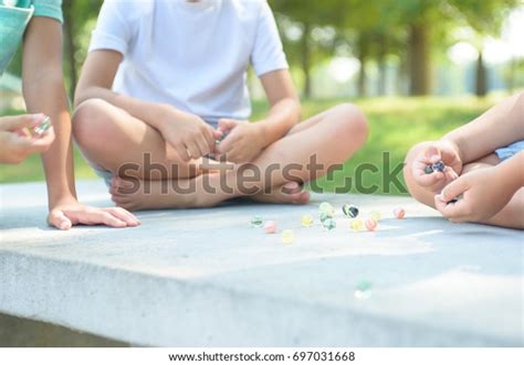 Kids Playing Marbles Game Outside Stock Photo 697031668 Shutterstock