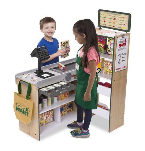 Two Children Standing In Front Of A Toy Cash Register