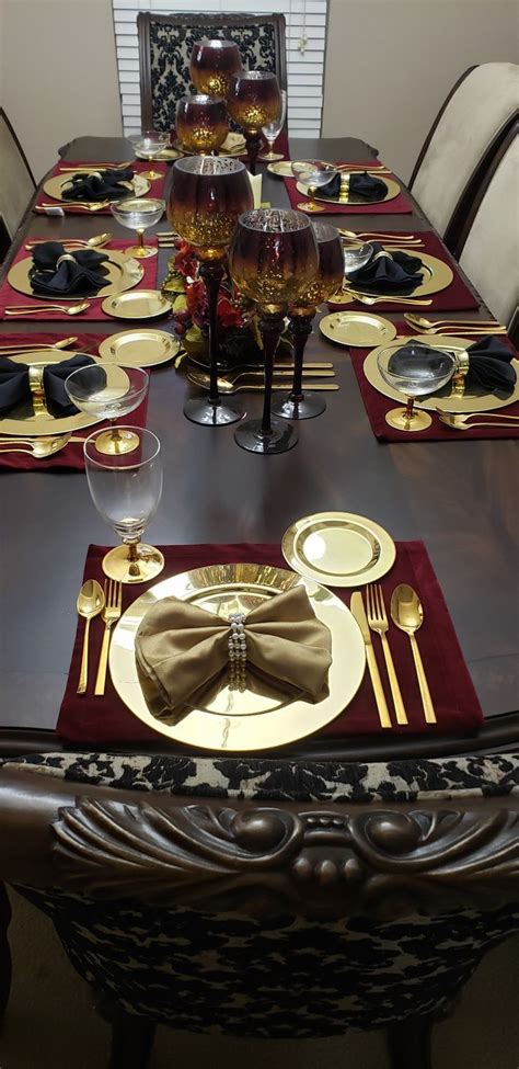 This dining room features purple chairs and table with gold accents that makes it to look even more elegant, which is what a victorian dining room should be. Burgundy, Black, and Gold Table Decor | Gold room decor ...