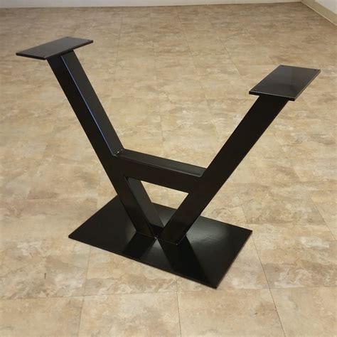 Attach bun feet to the bottom of a wooden table. Carla Table Legs - Custom Metal Home
