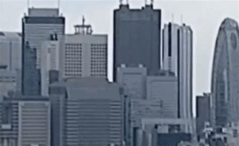 Earthquake, hide, scared, startled, surprise. GIF earthquake skyscrapers japan - animated GIF on GIFER