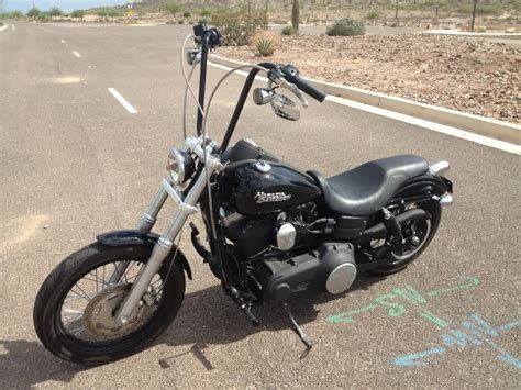 Longer than ever, it now has new chunky 49mm forks raked out to 36 degrees and a massive 21 laced front wheel. Dyna Ape Hangers photos ? - Page 18 - Harley Davidson Forums