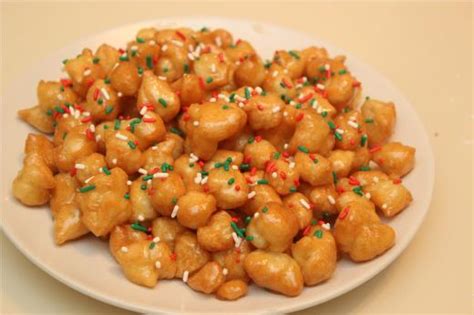 These tiny honey covered fritters are so addicting, you won't be able to walk through the kitchen without stopping to pop a few in your mouth. Struffoli Recipes by Cooking with Nonna