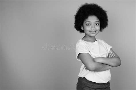 Young Cute African Girl With Afro Hair In Black And White Stock Photo
