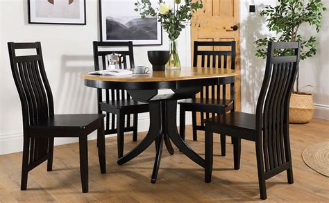Hudson Round Painted Black And Oak Extending Dining Table With Java Black Chairs Furniture