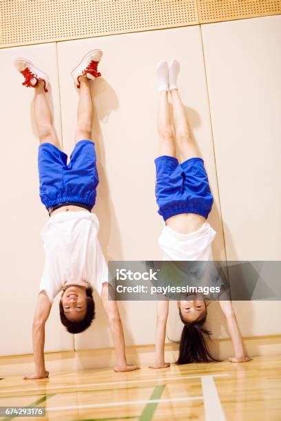 High School Students To Do Handstands Stock Photo Download Image Now