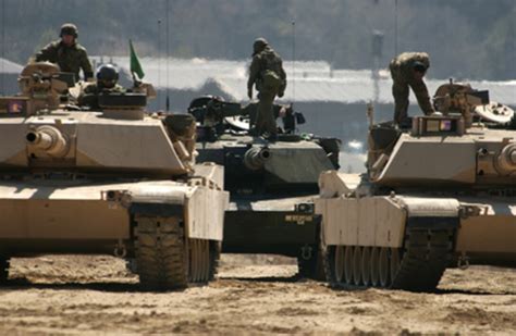 The Crews Of Us Army M1a1 Abrams Tanks Mount Up