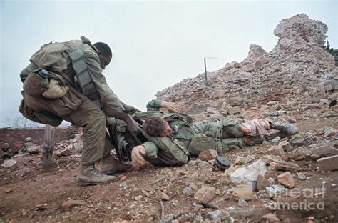 Wounded Marine Being Dragged To Safety By Bettmann
