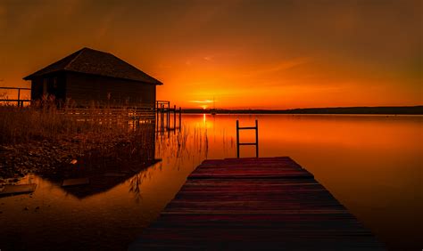 Orange Sunset On The Water By Bildermeineslebens