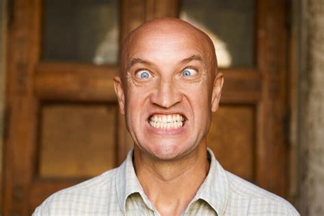 Premium Photo Portrait Of An Emotional Bald Guy With Blue Eyes