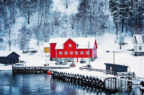 Premium Photo Red Wooden House On The Banks Of The Norwegian Fjord